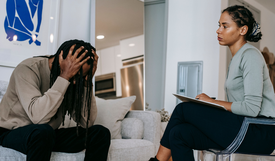 Clinician listening attentively to a patient during a first psychiatry appointment in Laurel, MD